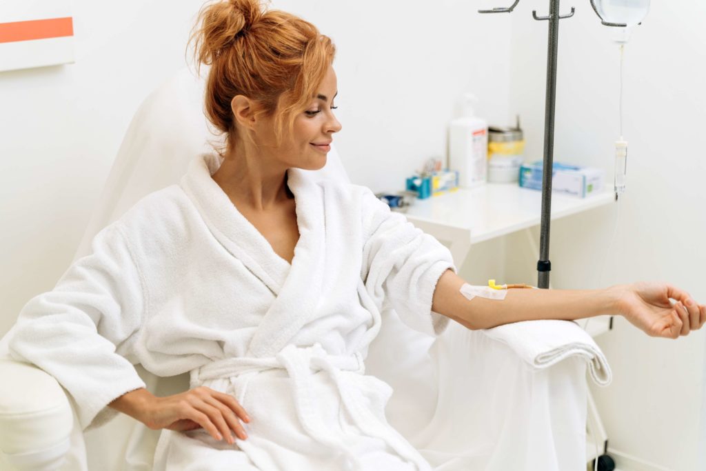 a women having Iv Infusion Therapy | Skin and Tonic | Pace, Florida, US